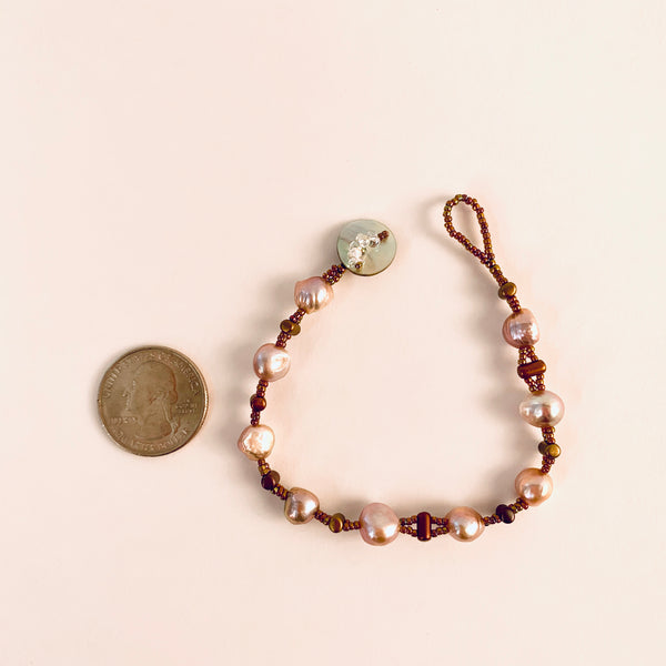 MAUVE PEARL AND GOLD BEAD BRACELET