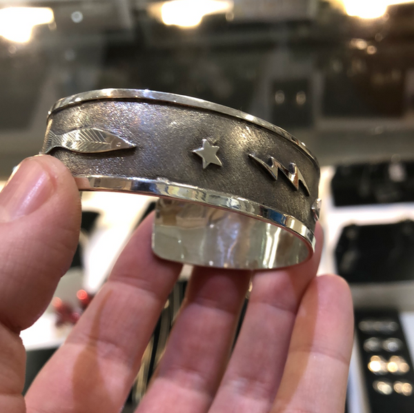 SALMON, STAR, MOON, AND LIGHTENING STERLING CUFF BRACELET
