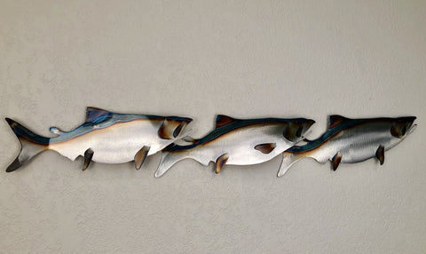 THREE SALMON SWIMMING HORIZONTAL